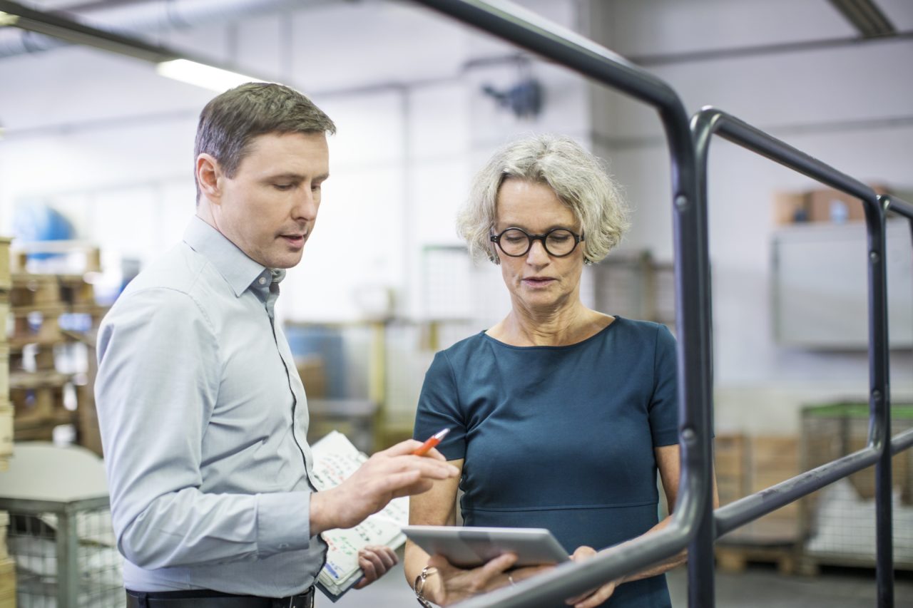 business people working in printing plant